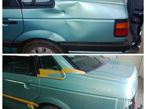 VW Passat mit großer Delle in der Seitenwand, vorbereitet zur Reparatur